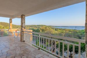 a balcony with a view of the ocean at B&B Paradiso - Pakleni Islands Hvar in Hvar