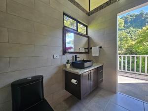 a bathroom with a sink and a mirror at CASITAS SELVARA in Platanillo