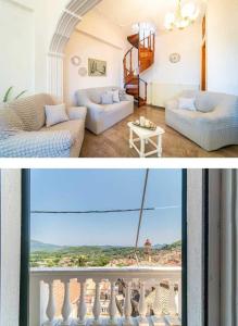 a living room with a couch and a balcony at Pavlos Sofia Suites in Corfu Town