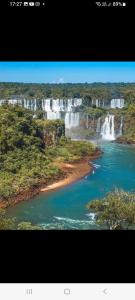 a view of a waterfall and a body of water at ALOJAMIENTO FAMILIAR in Puerto Iguazú