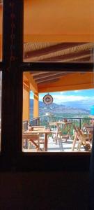 a view from a window of a porch with a picnic table at Casa Mamani in Tilcara