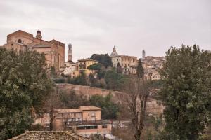 Nespecifikovaný výhled na destinaci Siena nebo výhled na město při pohledu z apartmánu