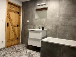 Koupelna v ubytování Apartmány Kanteho grunt
