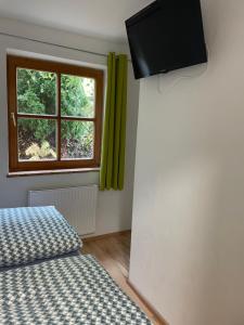 Televízia a/alebo spoločenská miestnosť v ubytovaní Apartment Sabrina