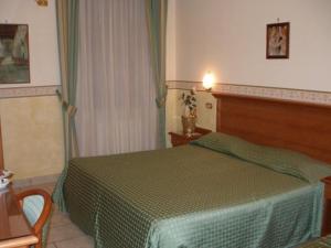 Postel nebo postele na pokoji v ubytování Hotel Lento