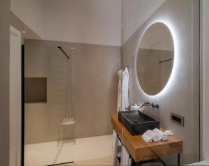 a bathroom with a sink and a mirror at Masseria Corsano in Nardò