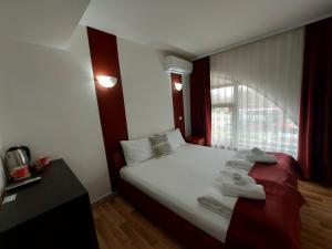 Voodi või voodid majutusasutuse The Bulevard Hotel toas