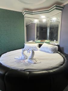 Postel nebo postele na pokoji v ubytování Hotel Paradise