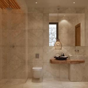 a bathroom with a toilet and a sink and a shower at Elaia Luxury House in Archangelos +46 photos
