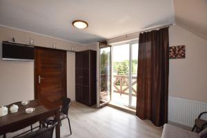 Et tv og/eller underholdning på Nadmorski Apartament Rodzinny