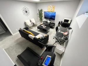 an overhead view of a living room with a couch at Stylish Basement Suite with Modern Comforts in Winnipeg