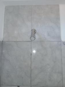 a shower with a light on a tile floor at El Tonel in Cafayate +35 photos