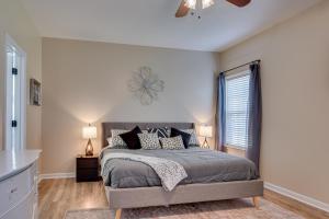 a bedroom with a large bed and a window at Our Corner Cottage in Aiken