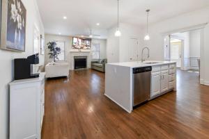 a kitchen and living room with a hard wood floor at Amazing Location Spacious House in Atlanta
