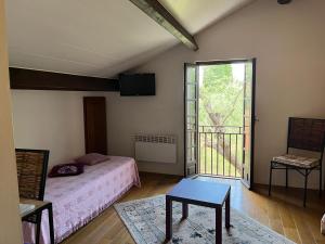 Postel nebo postele na pokoji v ubytování Domaine Le Clos des Oliviers + 37 fotografií