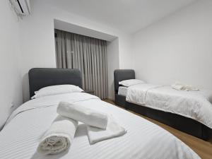 Ένα ή περισσότερα κρεβάτια σε δωμάτιο στο Elois Luxury Apartment