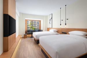 Postel nebo postele na pokoji v ubytování Fairfield by Marriott Zhuji + 12 fotografií