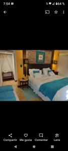 una foto de una habitación de hotel con 2 camas en Alonso Chacras Lodge en Chacras de Coria