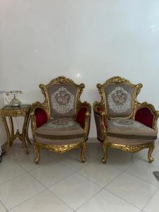 two chairs and a table in a room at perle du tanger in Tangier