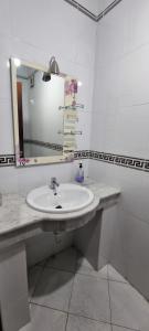a bathroom with a sink and a mirror at perle du tanger in Tangier