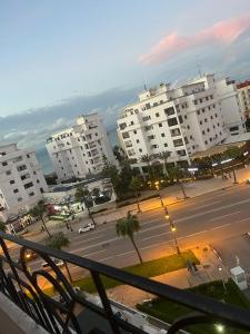 a view of a city with white buildings and a street at perle du tanger in Tangier