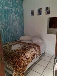 Säng eller sängar i ett rum på Pousada Vila Do Porto Ar Condicionado e Cafe Da Manha