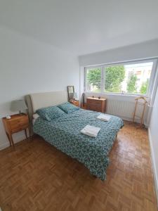 En eller flere senge i et værelse på Proche Paris-Château Versailles-St Germain