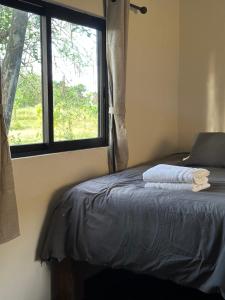 Cama ou camas em um quarto em Casitas at Rancho Kuxtal