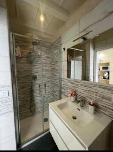 a bathroom with a glass shower and a sink at Casa Vacanza Al Duomo in Barletta