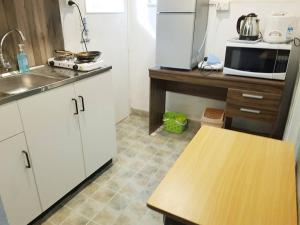 a kitchen with a sink and a counter top at Central Nadi - Lodge 2 in Nadi