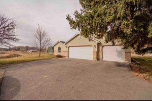 a house with two garage doors on a driveway at Wilson Family Retreat in Blackfoot