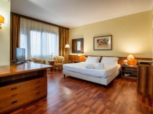Una cama o camas en una habitación de Residence Villa Azzurra