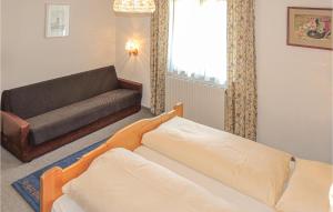 Una cama o camas en una habitación de Nice Apartment In Pettneu Am Arlberg With 2 Bedrooms And Wifi
