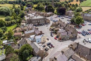 an aerial view of a town with cars parked in a parking lot at The Old Vet’s House in Masham