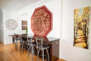 a dining room with a large mirror on the wall at Club Salon Sleeps 10-20 Free Parking & TV in Chicago
