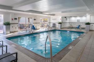 a large pool with blue water in a hotel room at Fairfield Inn and Suites Memphis Germantown in Memphis