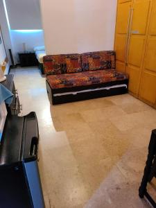 a couch sitting in a living room in a room at marina vallarta, One bedroom condo in Puerto Vallarta
