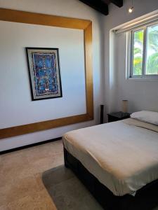 a bedroom with a large bed and a window at marina vallarta, One bedroom condo in Puerto Vallarta