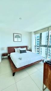 a bedroom with a large bed and a large window at Monte Carlo Suites in Miami Beach in Miami Beach