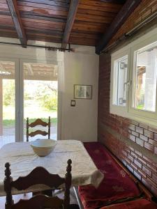 a room with a table with a bowl on it at Cosy House by the Sea in Kato Achaia