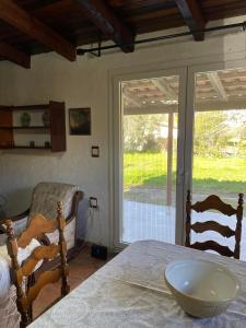 a room with a bed with a bowl on a table at Cosy House by the Sea in Kato Achaia