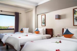Letto o letti in una camera di Ratana Angkor Hotel