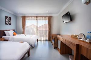 Letto o letti in una camera di Ratana Angkor Hotel