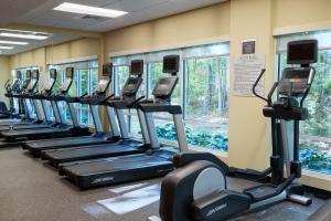 a row of treadmills in a gym with windows at TownePlace Suites By Marriott Columbia West/Lexington in West Columbia
