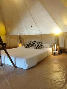 a bedroom with a large bed in a tent at Ella Retreat Glamping Tent on Hill for Nature Lovers in Ella
