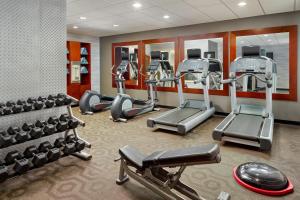 a gym with treadmills and ellipticals in a room at Fairfield Inn & Suites by Marriott Jackson in Jackson