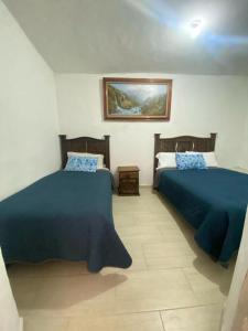 Hotel Noche Azul客房内的一张或多张床位