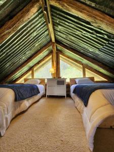 מיטה או מיטות בחדר ב-Hermosa y Nueva Cabaña de campo - La Candelaria Farm House