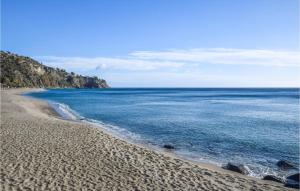 a view of a beach with the ocean at Cozy Apartment In Isca Marina With Wifi in Isca sullo Ionio