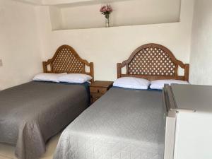 Hotel Noche Azul客房内的一张或多张床位